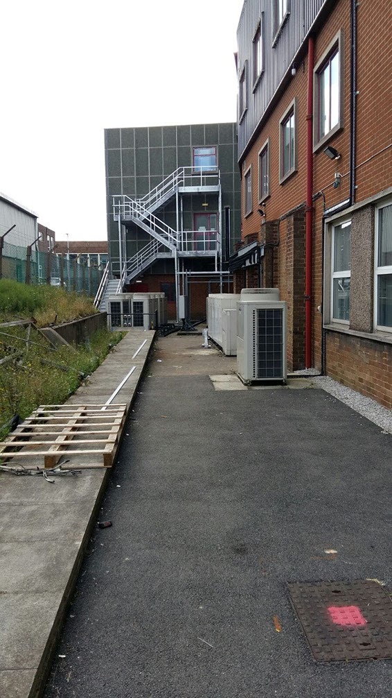 A two storey external galvanised fire escape staircase. Designed, supplied & installed by ASH Construction Ltd.