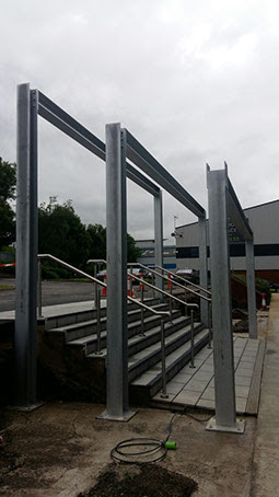 Structural steel work and stainless steel hand railings for canopy entrance. Designed, supplied & installed by ASH Construction Ltd.